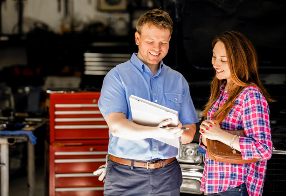 Man and Woman in Mechanic Shop Man and Woman in Mechanic Shop